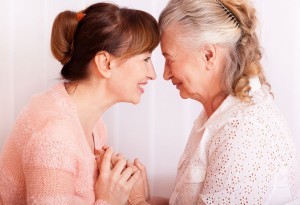 Two Woman Facing Each Other and Smiling